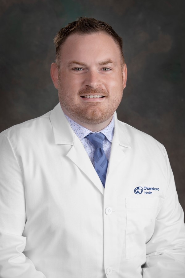 a picture of a Caucasian man in a white doctor's coat