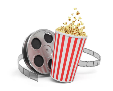 Movie reel and cup of popcorn