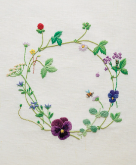 Embroidered stems and flowers in a circular shape