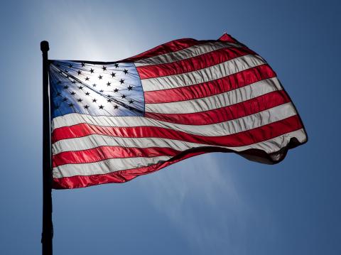 American flag waving in the sky