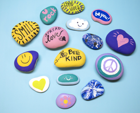 Rocks painted with encouraging messages