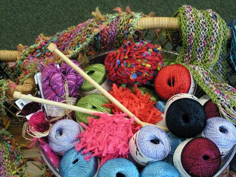 a basket of thread and yarn