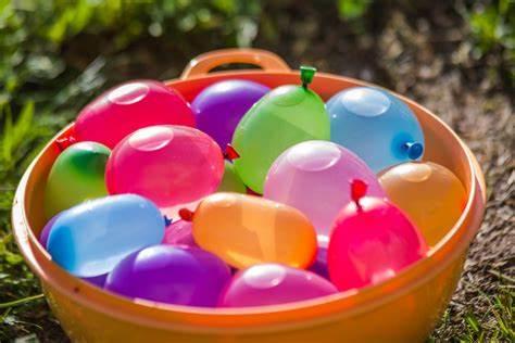 a bucket full of water balloons