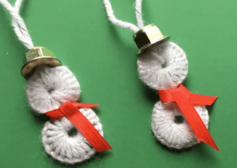 Snowman ornaments made out of nuts, washers and yarn