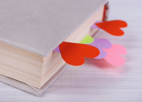 Heart-shaped bookmarks sticking out of a book