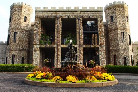 photo of Kentucky Castle in Versailles with fountain in front