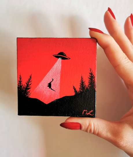 Small painting of a UFO lifting up a longneck dinosaur