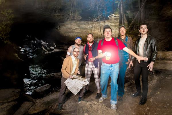 Several people in a cave