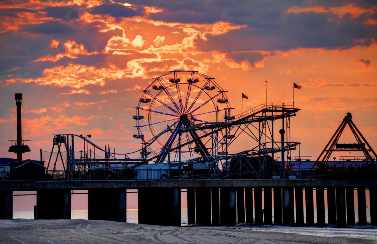 Boardwalk with ferris wheel in background