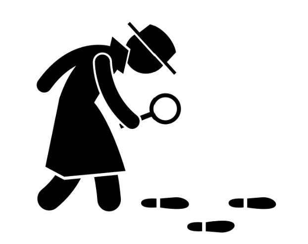 Detective examining a trail of footprints